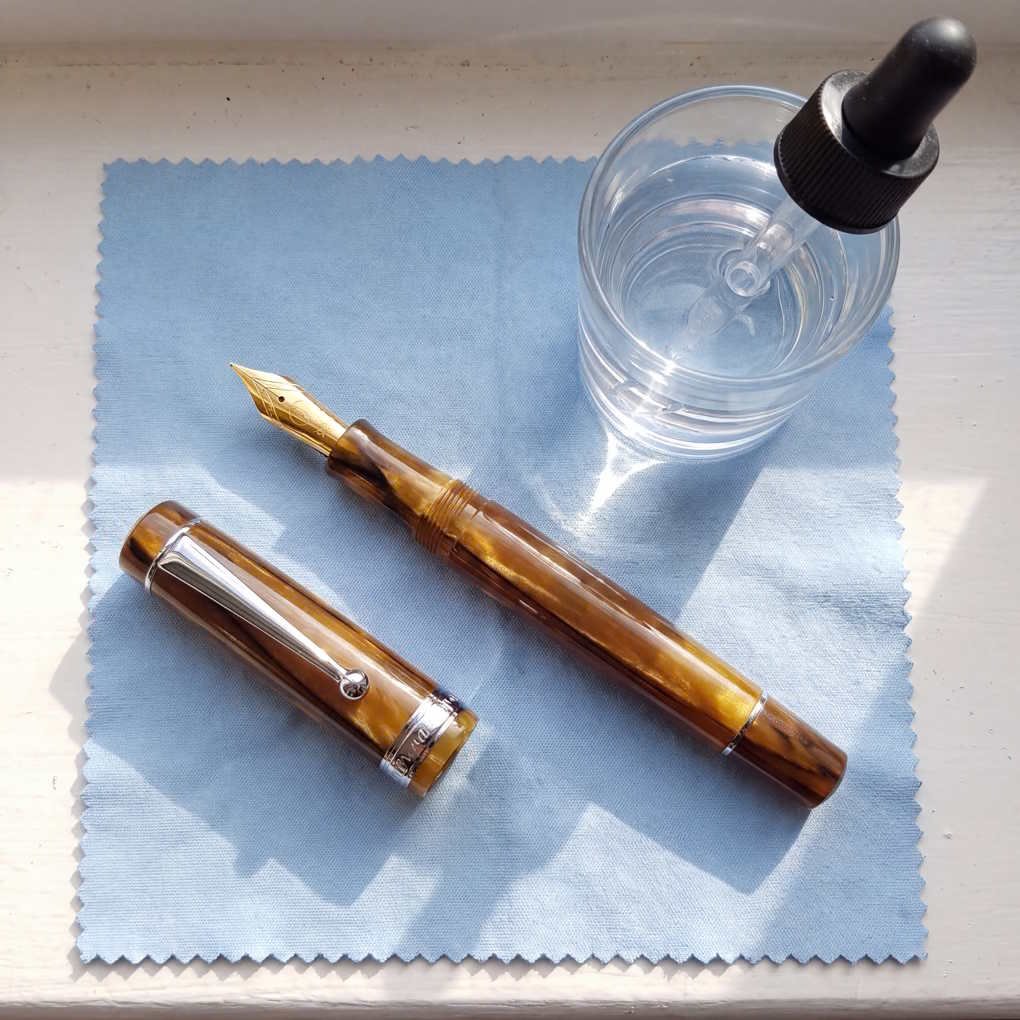 How To Use A Fountain Pen - Disassembled Fountain Pen Parts Resting On A Soft Cloth For Cleaning | The List Of